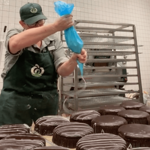 Viral Video Shows How Woolies Mudcakes Are Made & It's SO Satisfying